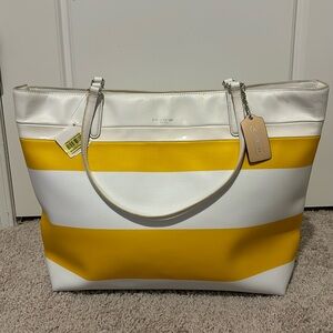 Yellow and white striped coach tote bag.